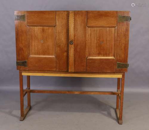 An English oak Arts and Crafts cabinet, early 20th century, ...