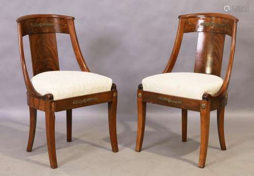 A pair of French mahogany chairs, Empire style, first quarte...