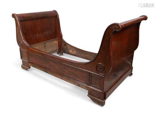 A French mahogany bateau lit, 19th century, with scroll ends...