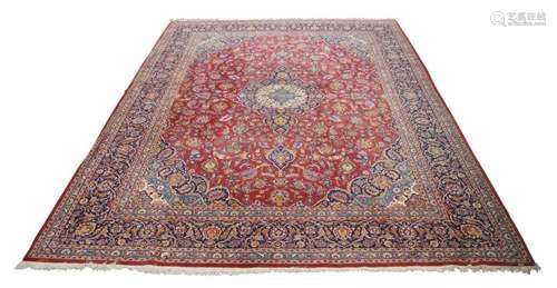 A Persian Kashan carpet, late 20th century, central floral m...