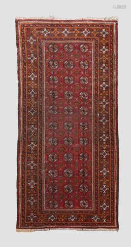 A Turkoman Bokhara rug, with repeating gul motifs on a red g...