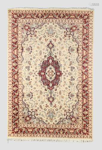 An Indian Kashmir carpet, the central medallion surrounded b...