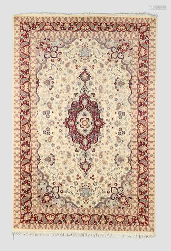 An Indian Kashmir carpet, the central medallion surrounded b...