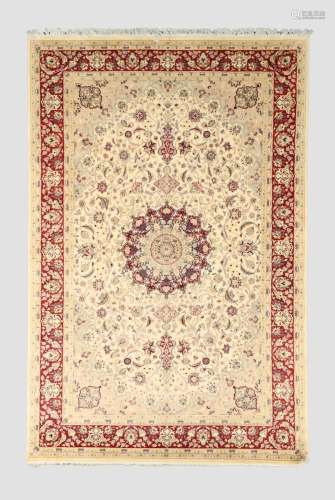 An Indian Kashmir carpet, the central floral medallion surro...