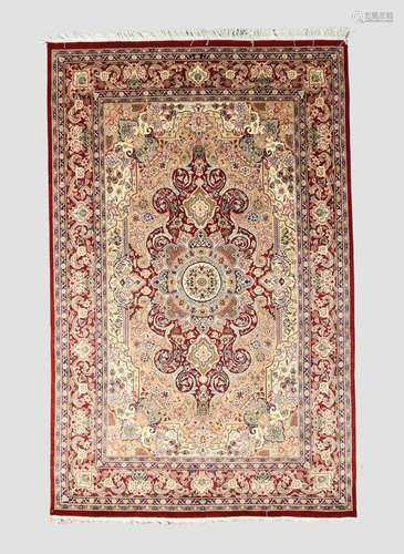 An Indian Kashmir carpet, the central floral medallion surro...