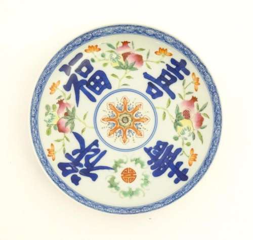 A Chinese plate decorated with pomegranates, flowe…