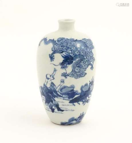 A Chinese blue and white vase decorated with a fig…