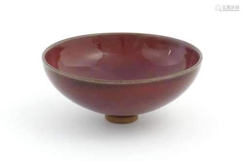 A Chinese sang de boeuf footed bowl. Approx. 2 3/4…