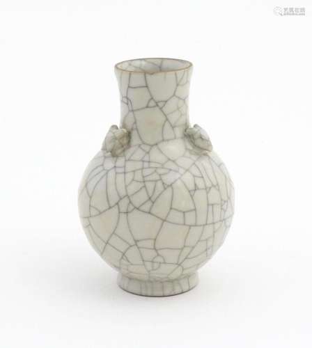 A small Chinese crackle glaze vase with four styli…