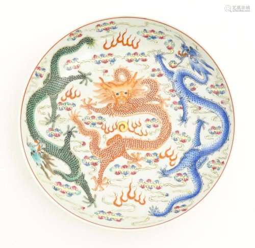 A Chinese famille rose plate decorated with three …