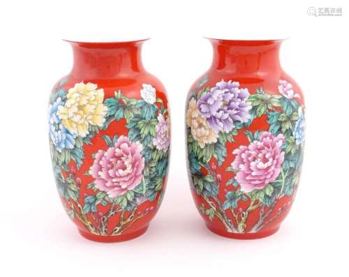 A pair of Chinese baluster vases, the red ground d…