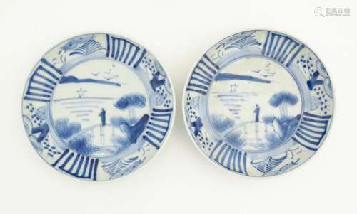 A pair of Oriental blue and white dishes each depi…