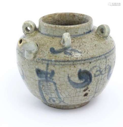 An Oriental stoneware water pot / jar with four lo…