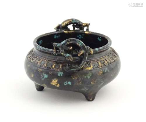 A Chinese censer with twin handles of stylised sal…