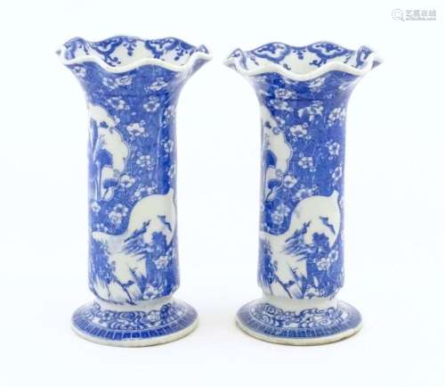 A pair of Oriental blue and white vases with lobed…