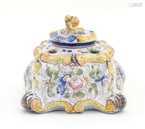 A Continental faience inkwell of shaped form with …