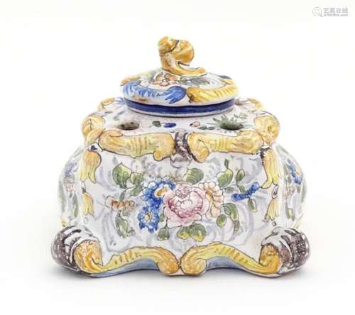 A Continental faience inkwell of shaped form with …