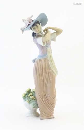 A Lladro figure titled Paris in Bloom, model no. 6…