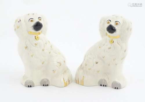 A pair of Beswick Staffordshire dogs with gilt hig…