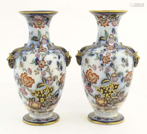 A pair of Oriental baluster vases with twin stylis…