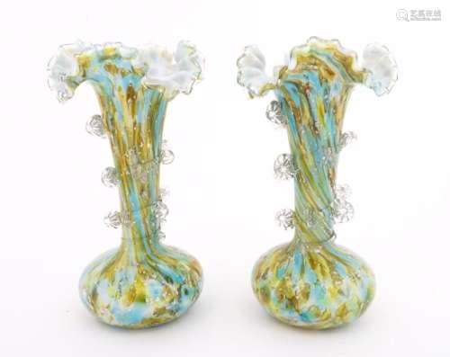 A pair of art glass vases with flared rims and pru…