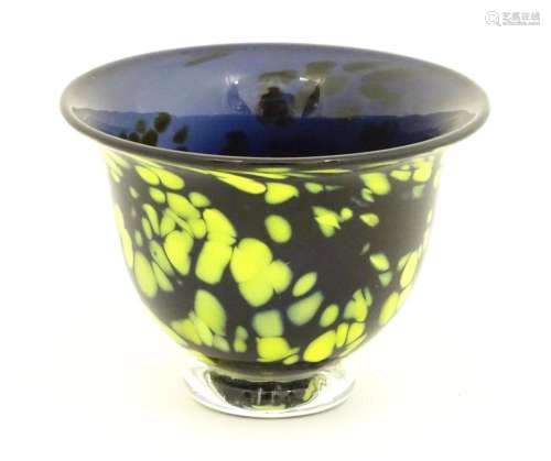 A Welsh art glass bowl with mottled yellow detail.…