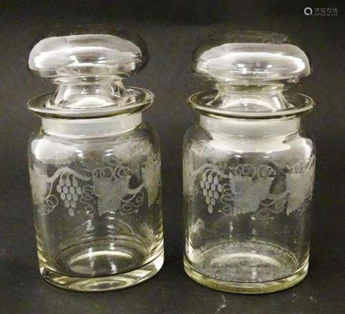 Two glass jars and stoppers decorated with etched …