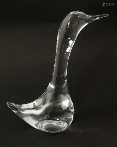 A clear glass model of a goose, signed Daum France…
