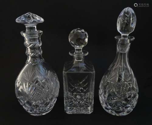 Three various cut crystal / glass decanters. The …