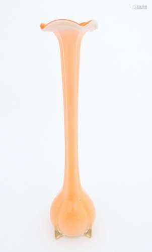A tall Empoli orange glass vase. Approx. 20" high …