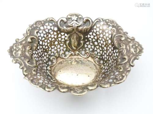 A silver bonbon dish with embossed and pierced dec…