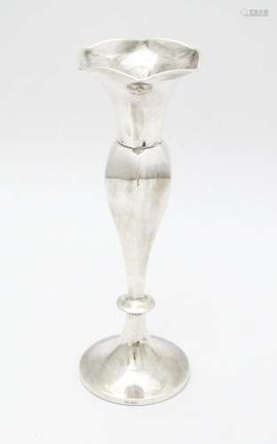 A white metal bud vase marked 'Silver' . Approx. 7…