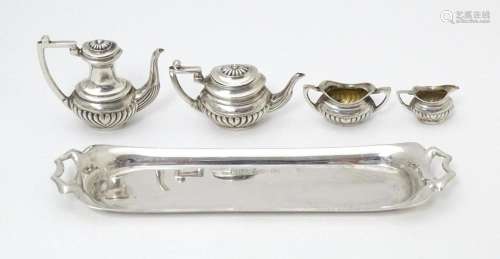 A silver 5 piece miniature / dolls house tea set c…
