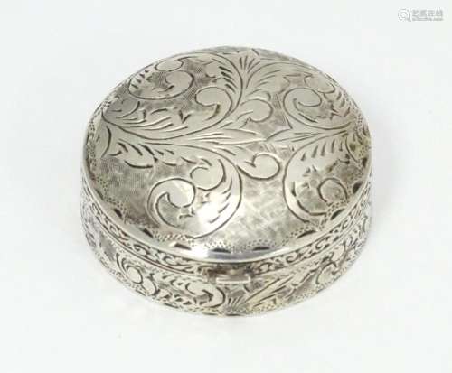 A .925 silver pill box of circular form with engra…