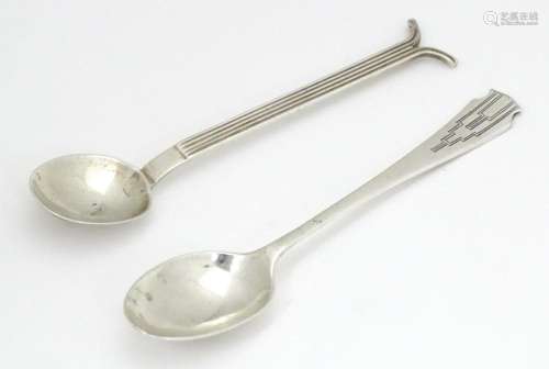 Two Art Deco silver spoons one with engraved geome…