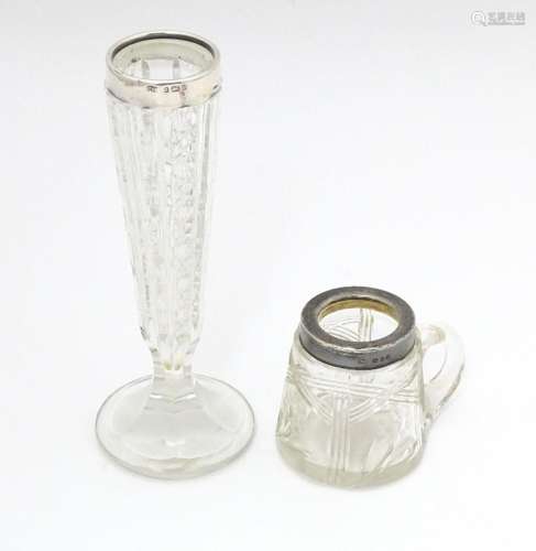 A cut glass bud vase with silver rim hallmarked Bi…