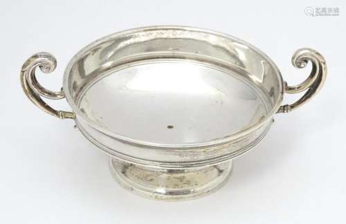 A silver bon bon dish with twin handles. hallmarke…