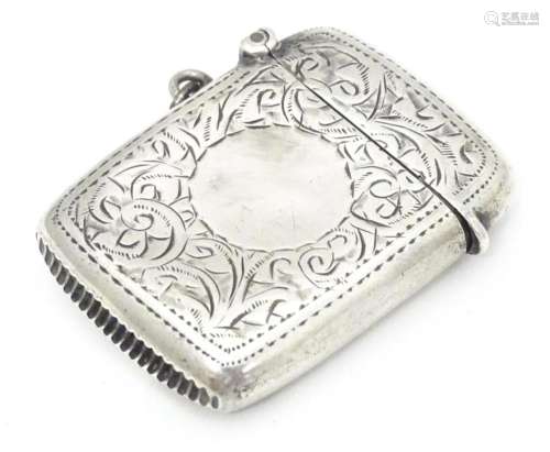 A silver vesta case with engraved decoration, hall…