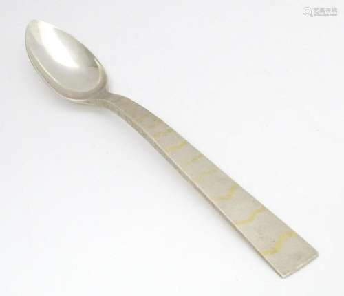 A Queen Elizabeth II Scottish silver serving spoon…