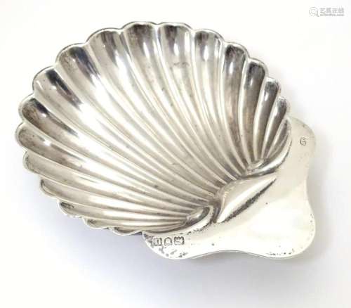 A silver butter dish of shell form. Hallmarked Lon…