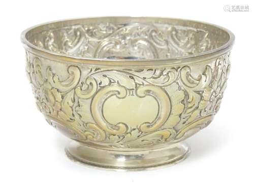 A Victorian silver bowl with embossed decoration h…