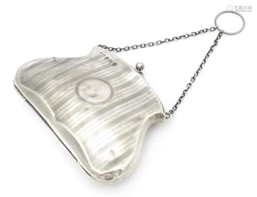 A silver purse with chain handle, hallmarked Birmi…