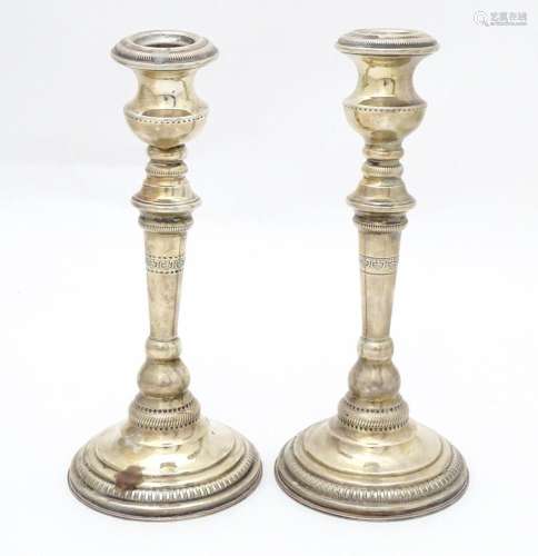 A pair of .925 silver candlesticks. Approx 8" high…