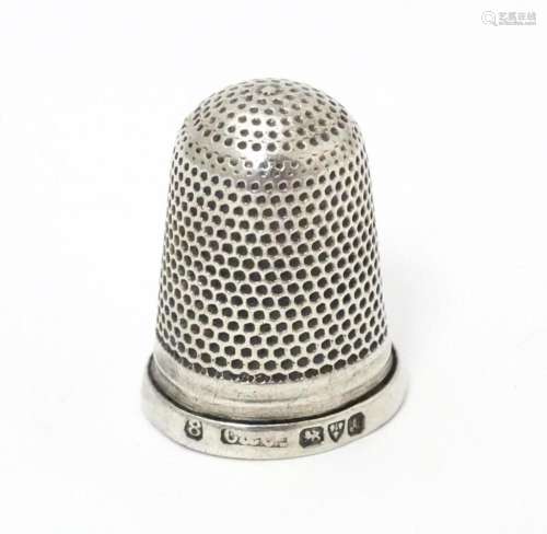 A silver thimble hallmarked Chester 1901 …