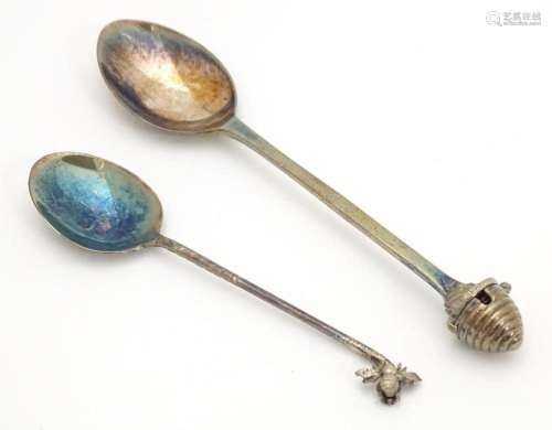 Two silver teaspoons, one with handle formed as a …