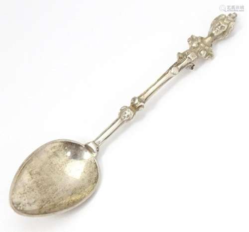 A Victorian Scottish silver spoon, the handle surm…