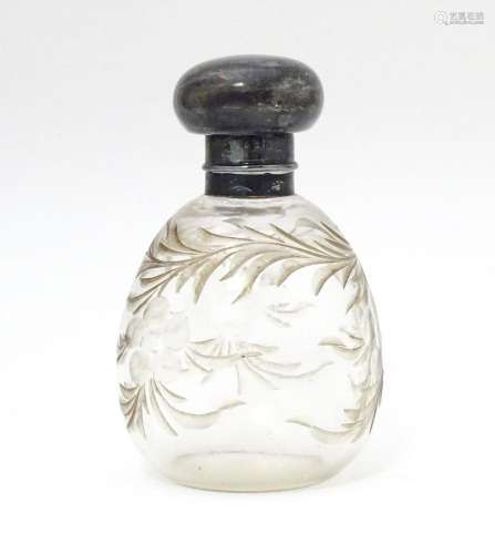 A cut glass scent / perfume bottle with silver top…