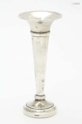 A silver bud vase hallmarked Birmingham 1986, make…