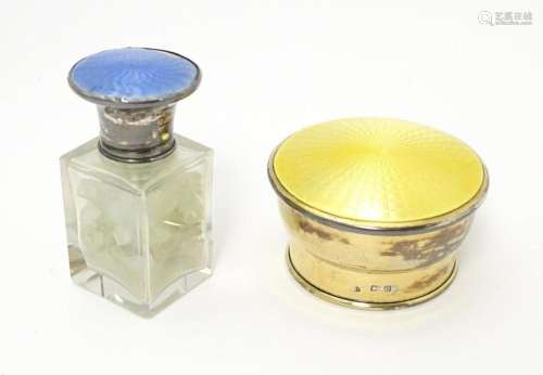A glass salts pot with silver top and blue enamel …