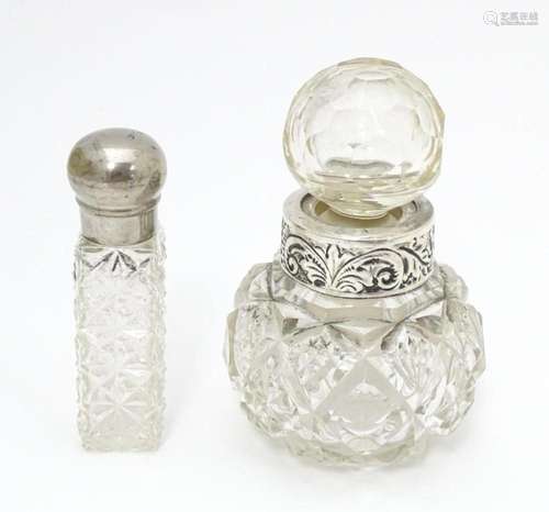 A cut glass scent / perfume bottle with white meta…